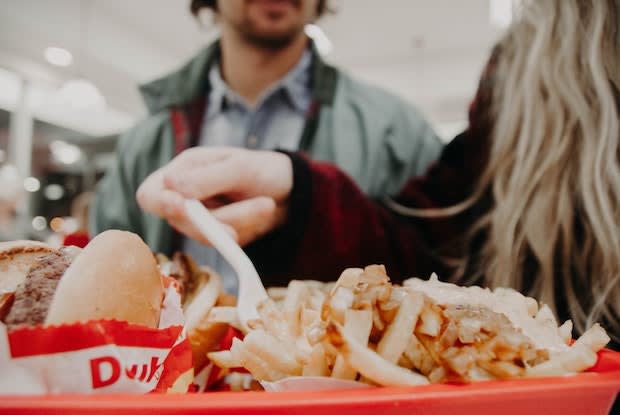 a couple eating at a fast-food chain