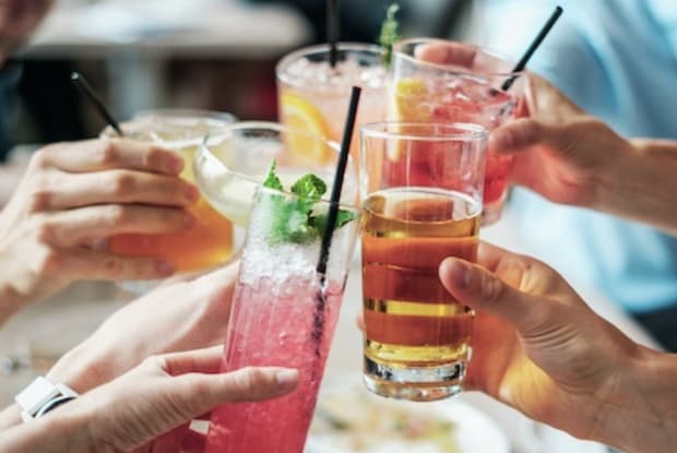 A group of people clinking glasses