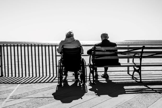 an older couple looking out over the ocean