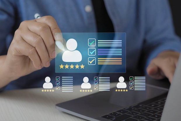 an overlay of customer reviews on an image of a customer leaving a positive five-star review on their personal laptop.