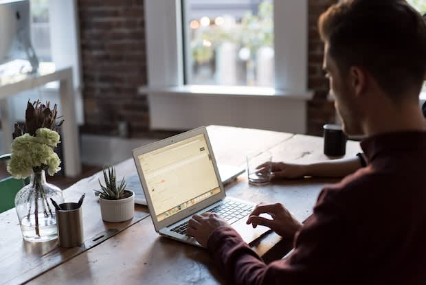 a man at a laptop