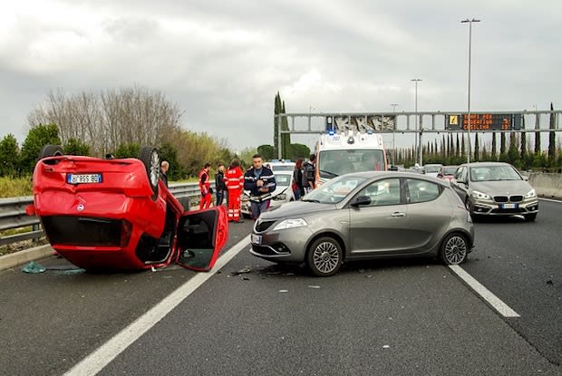 a photo of an overturned car