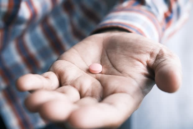 a pill in a hand