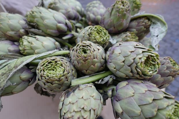 several artichokes on a stalk