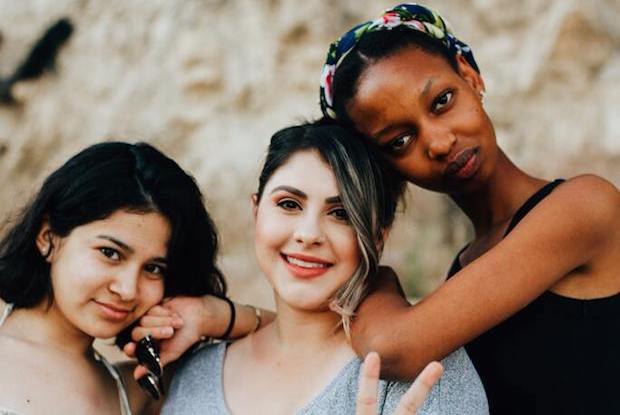 three girls embracing each other