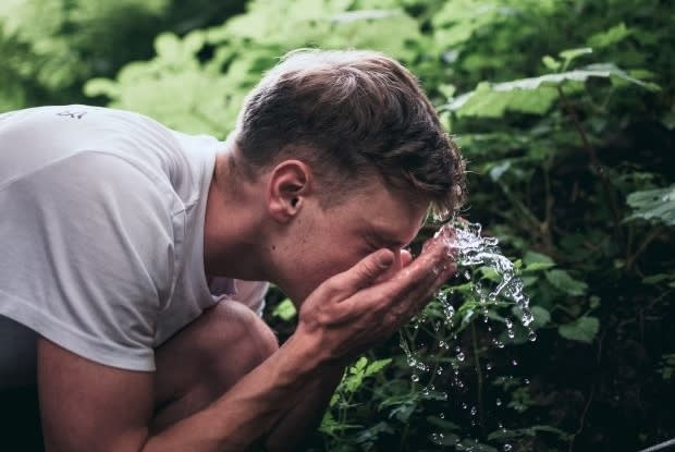 a man washing his face