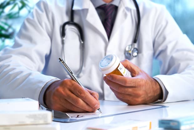 A doctor writing a prescription