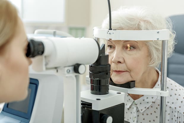 an older woman getting an eye exam