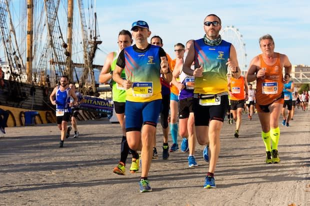 a group of men running a marathon