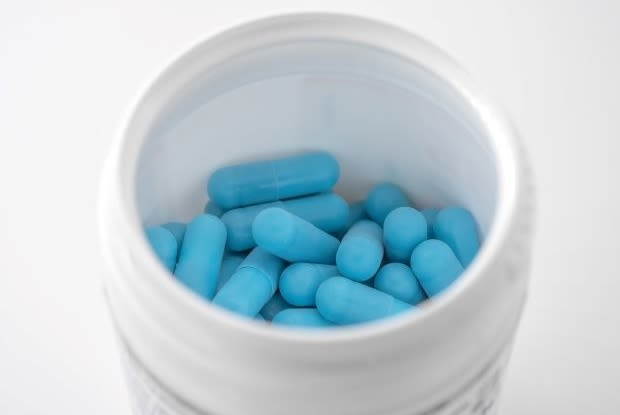 a bottle of blue pills