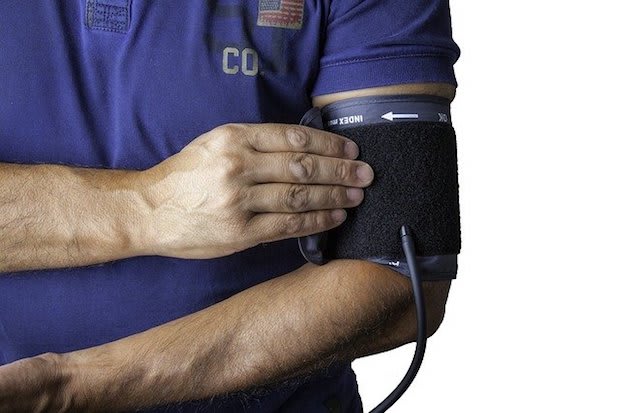 a man wearing a blood pressure cuff