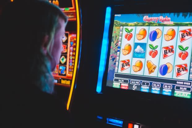 a person using a slot machine