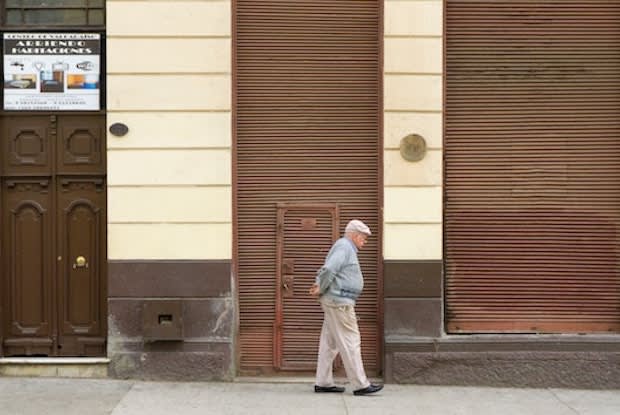 an older man walking on the street