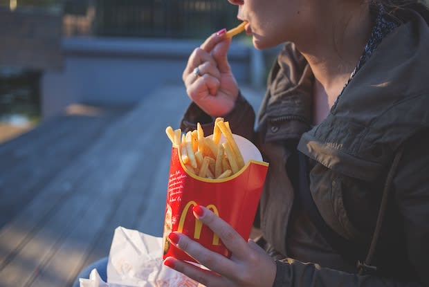 Woman eating mcdonalds fries