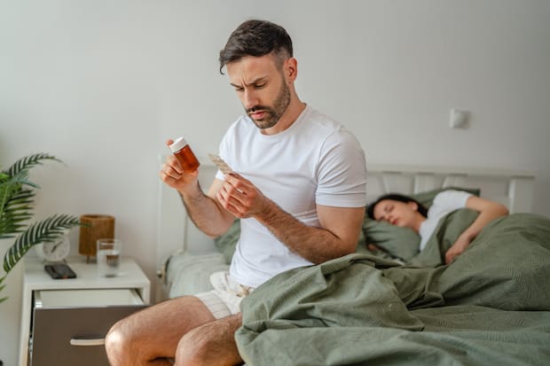 a man thinking about taking erectile dysfunction medication