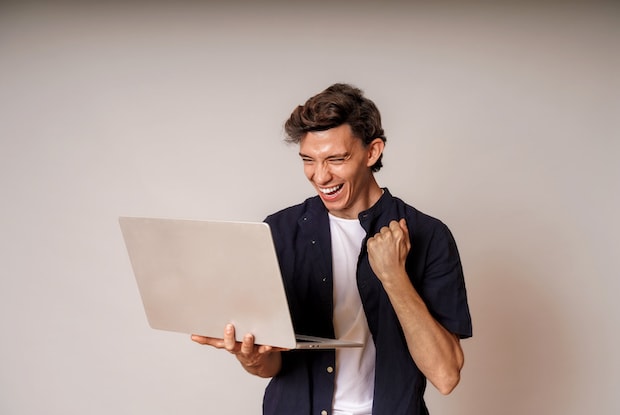 a man celebrating his online order to treat erectile dysfunction