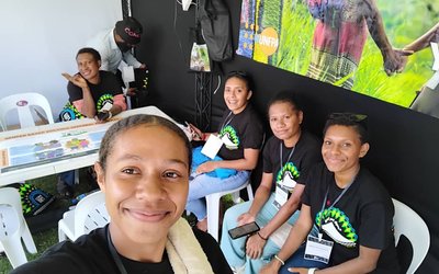 Two of our members seated during an event held at Sir John Guise Stadium to promote equality for woman in the workforce.