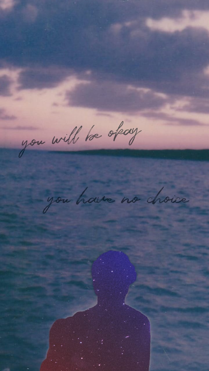 You Will Be Okay: A moody, dreamlike image of a figure standing at the edge of a body of water under a cloudy, violet-tinged sky. The silhouette of the person is filled with a starry galaxy texture, blending space with earth. Two lines of delicate cursive text hover in the sky and sea, reading: 'you will be okay' and 'you have no choice.' The image evokes resilience, melancholy, and a quiet strength in the face of inevitability.