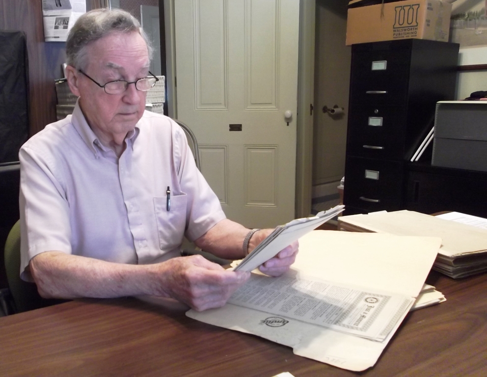 Museum Aide reviewing historical documents