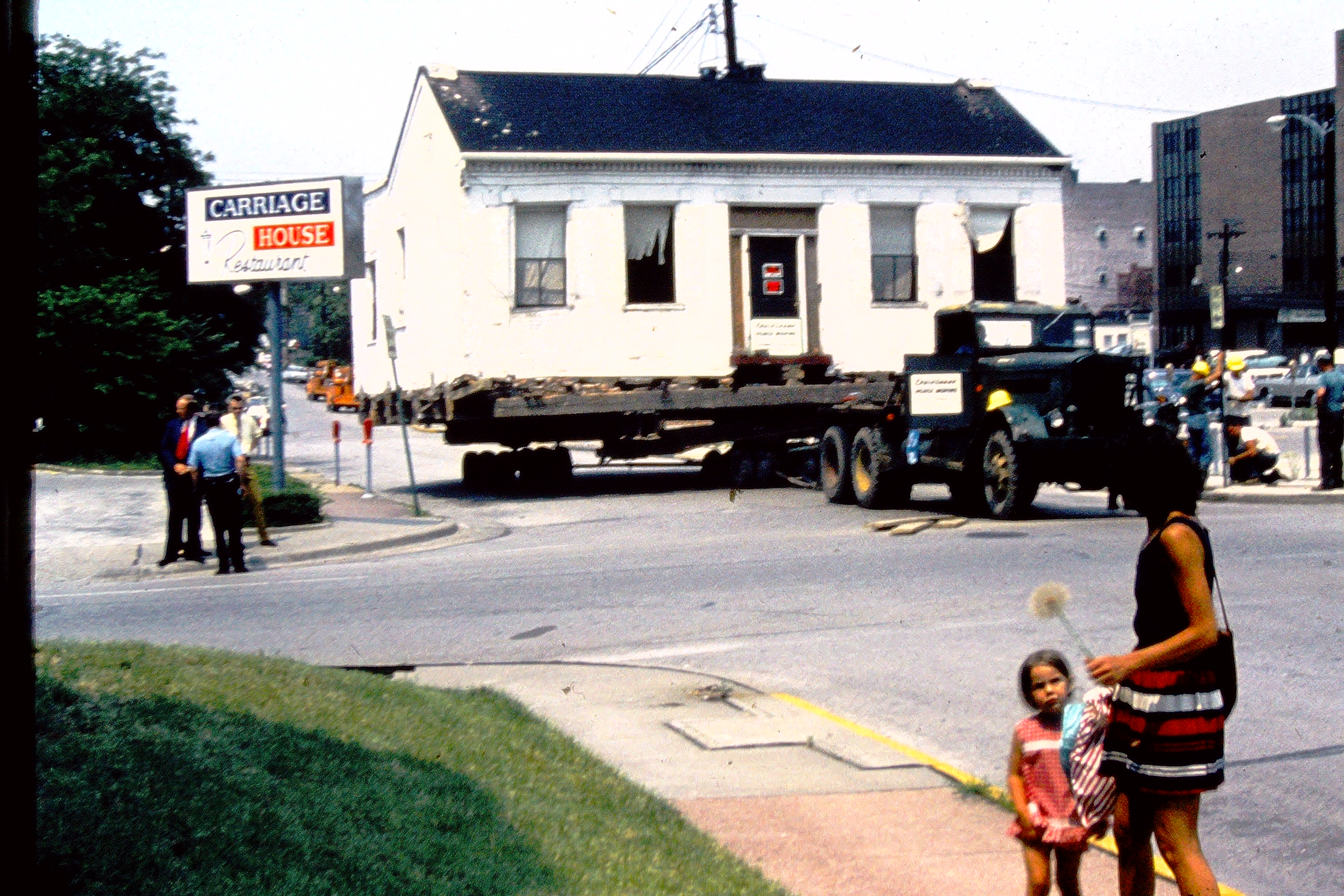 The Emma Kunz House during its move sitting at the corner of E. Washington & S. Charles Streets.