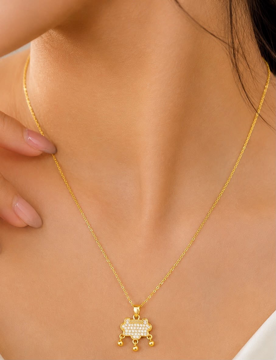 Gold-Tone Dangle Charm Necklace with Clear