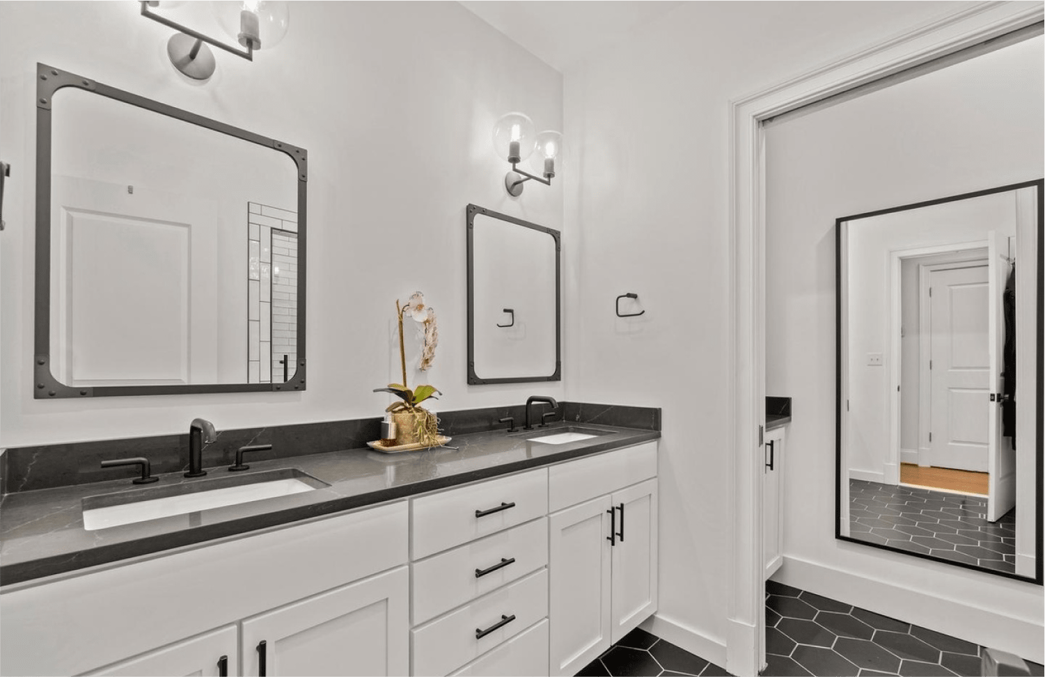Classic Elegance Reimagined bathroom design featuring elegant tile and lighting in Washington DC