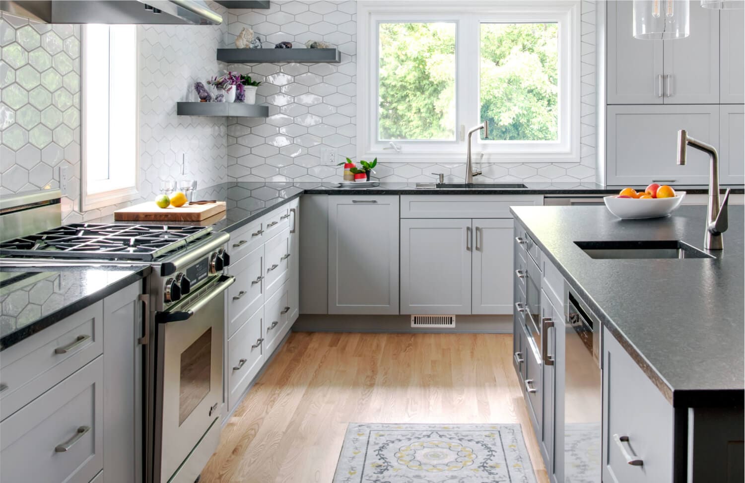 Industrial Urban kitchen remodel with gray shaker cabinets and dark countertops in Washington DC