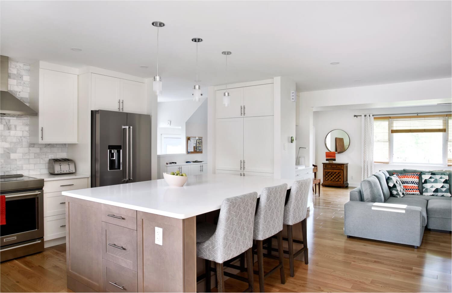 Minimal Elegance kitchen renovation featuring large island and white countertop in Washington DC
