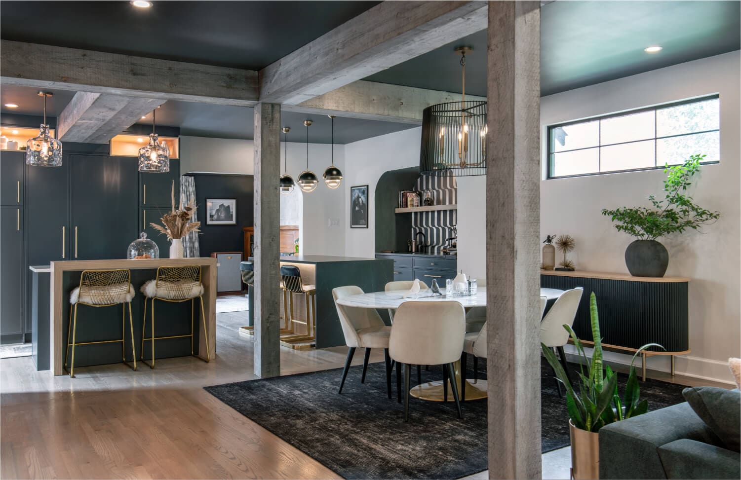 Modern designer kitchen remodel featuring custom dark cabinetry and brass hardware in a Washington DC home