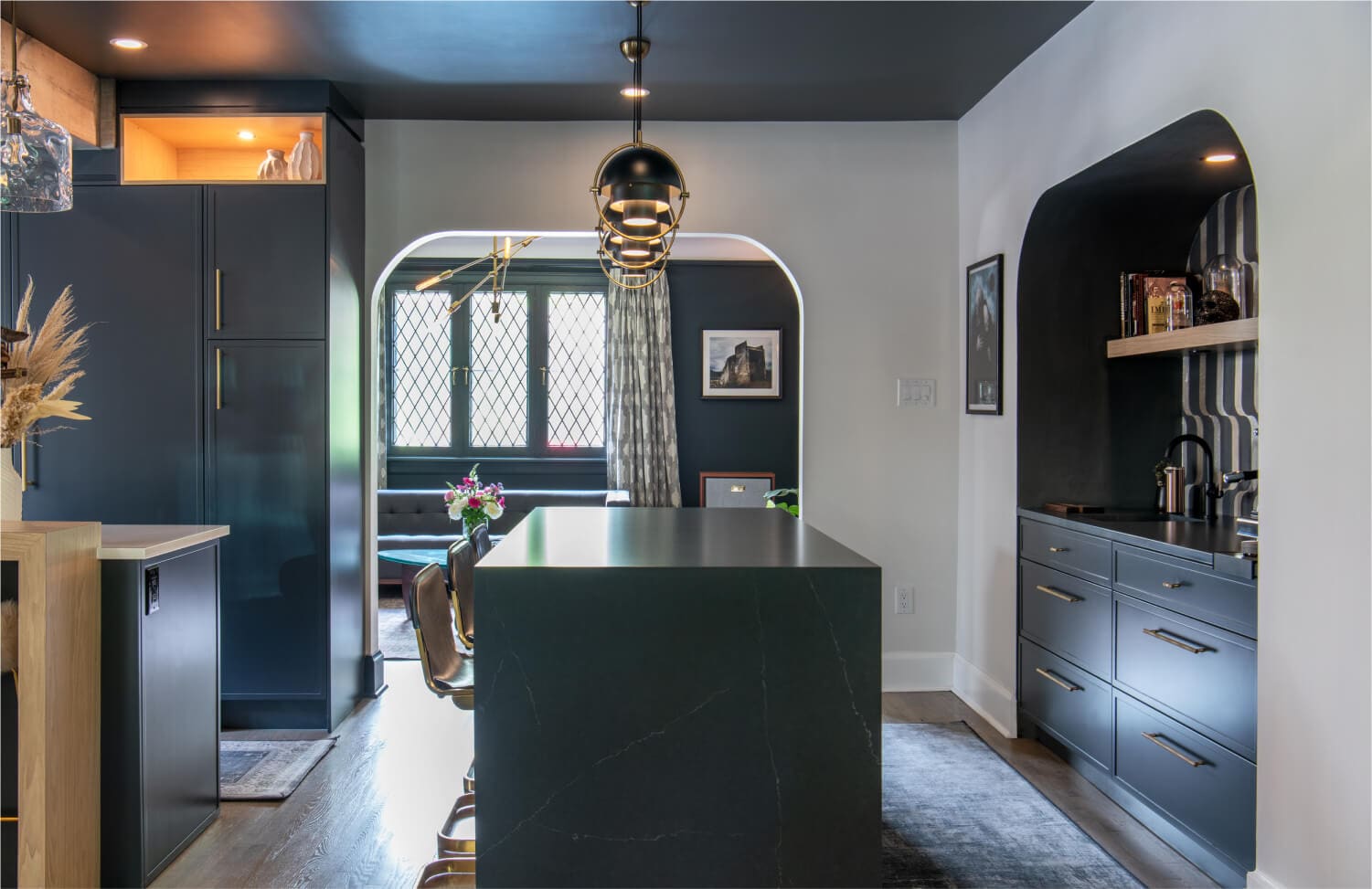 Architectural modern kitchen design with dark cabinets and statement island in Washington DC
