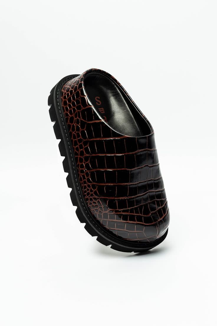 A brown high platform clog