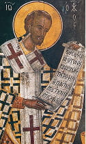 St. John Chrysostom reading something (presumably a St. Michael's bulletin)