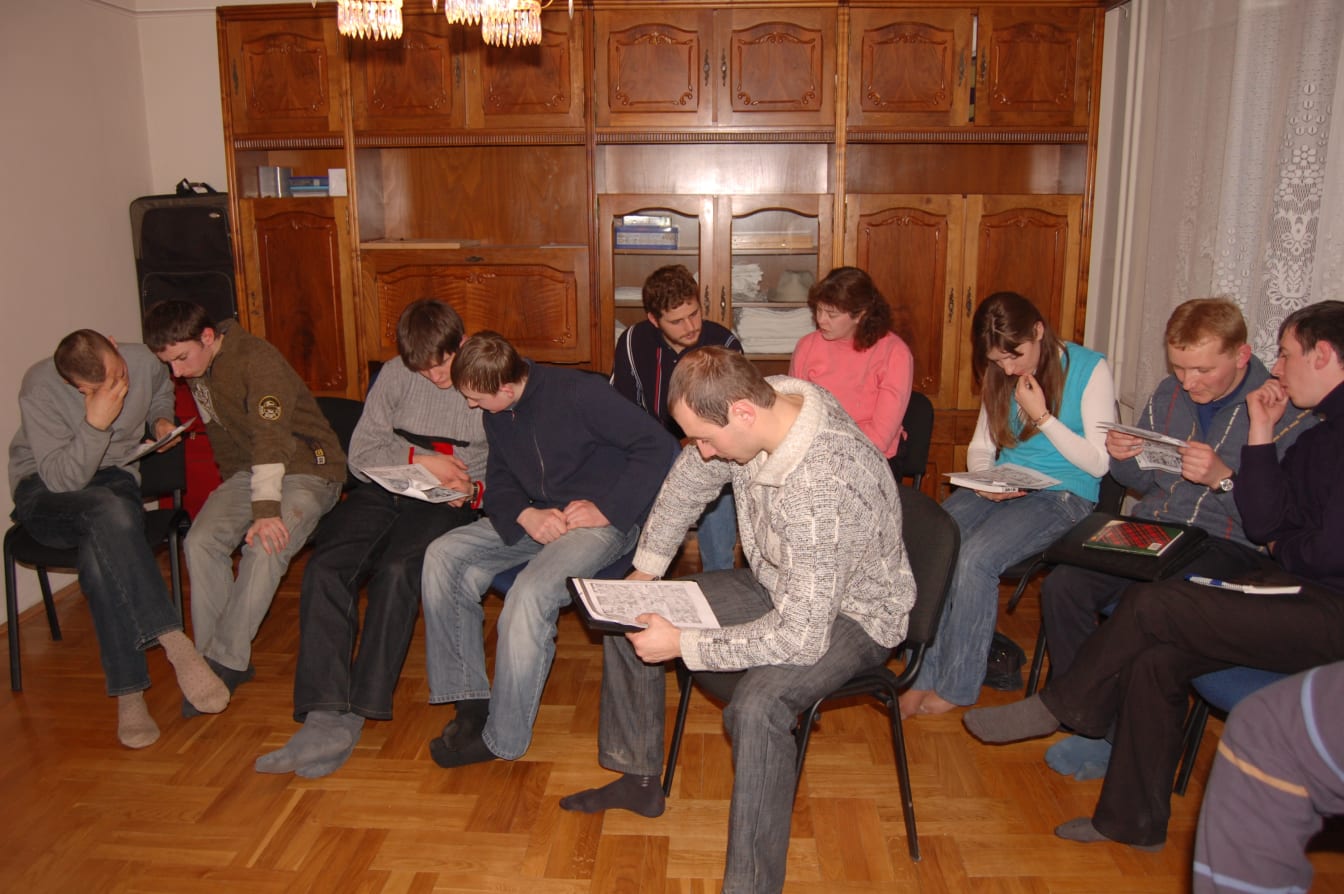 ABS students take turns reading through a selection from Good and Evil during English Club.