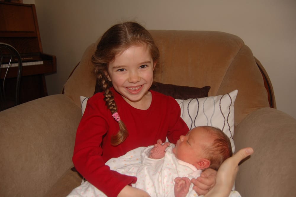 Abigail gets to hold Hosanna for the first time.