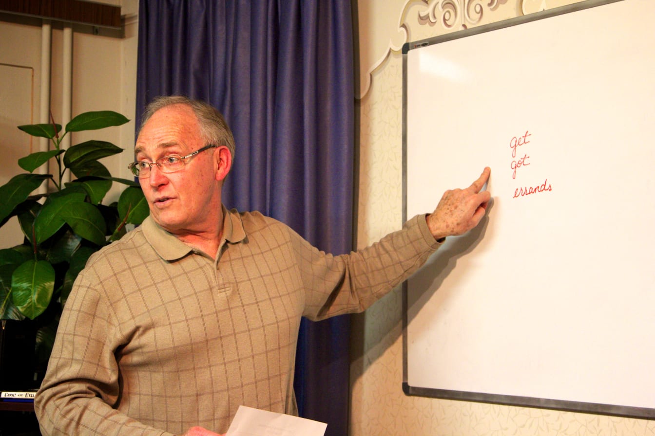 Jessie explains some English words at the white board.