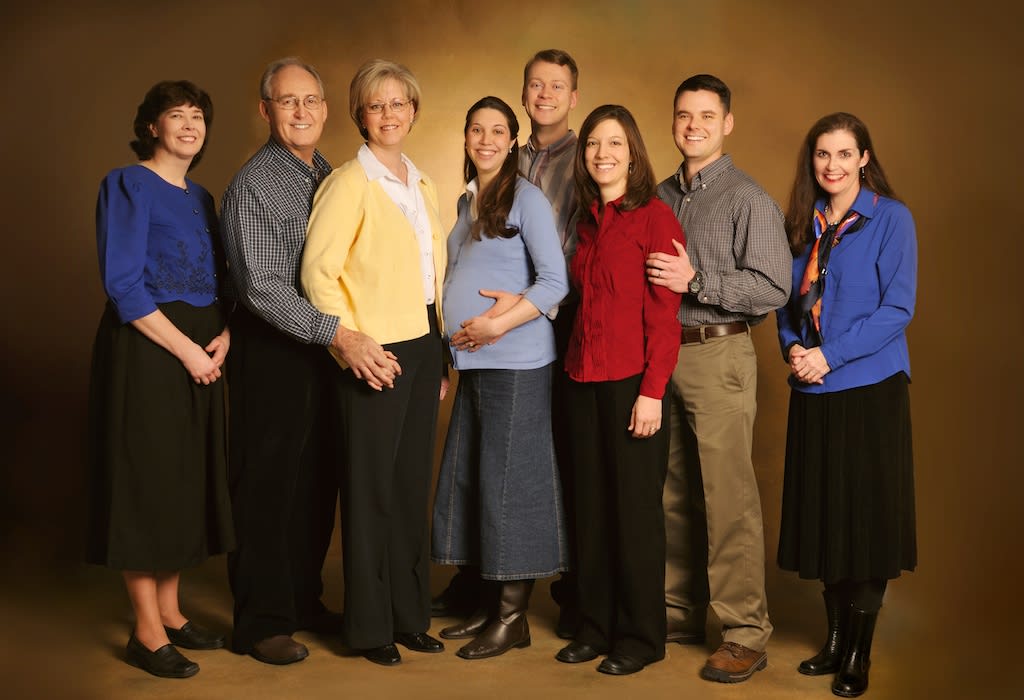 Studio group portrait of the eight-member Euro Team Outreach missionary team