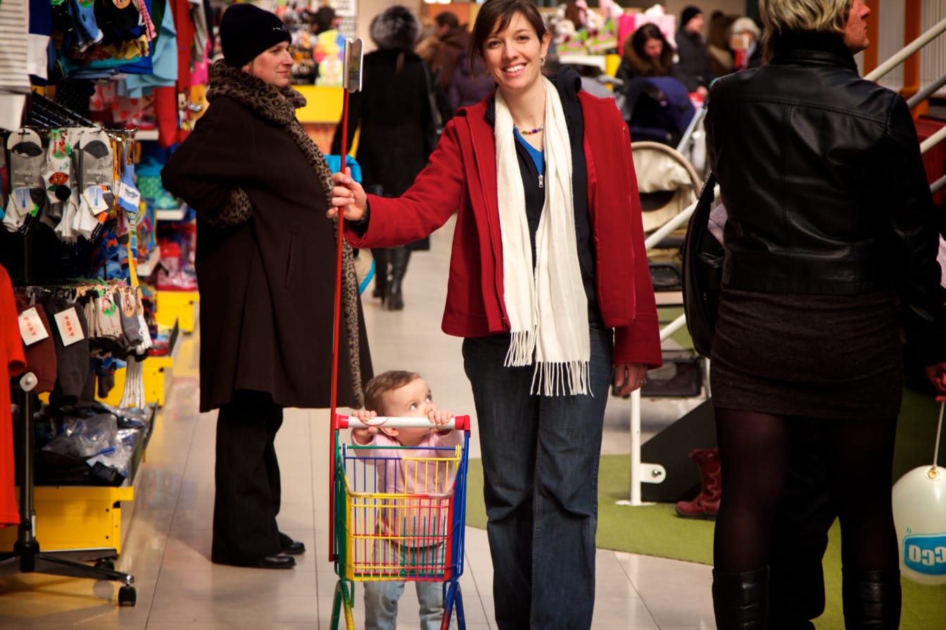 Hosanna loves to push the basket with Mommy.