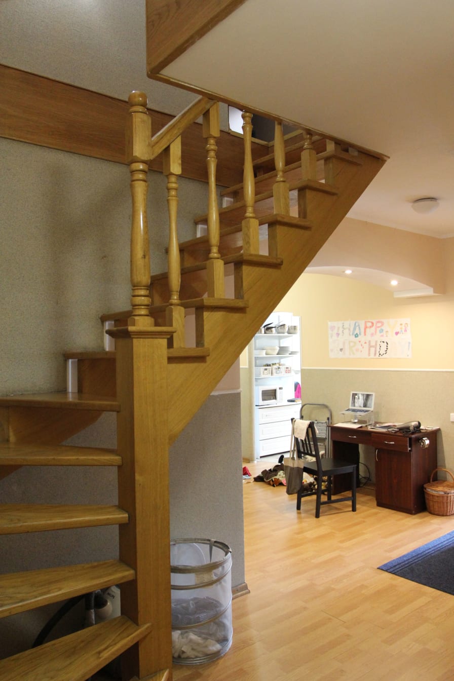 The wooden staircase leading up to the second floor of our apartment.