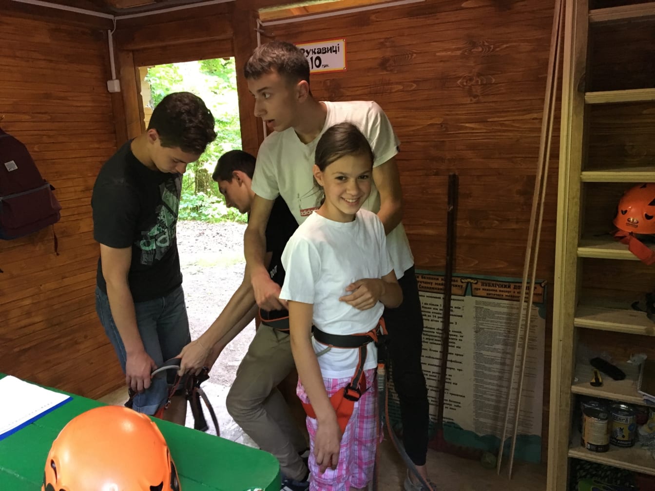 Anya Medyakovska and her brother Danylo get suited up with a harness and helmet.