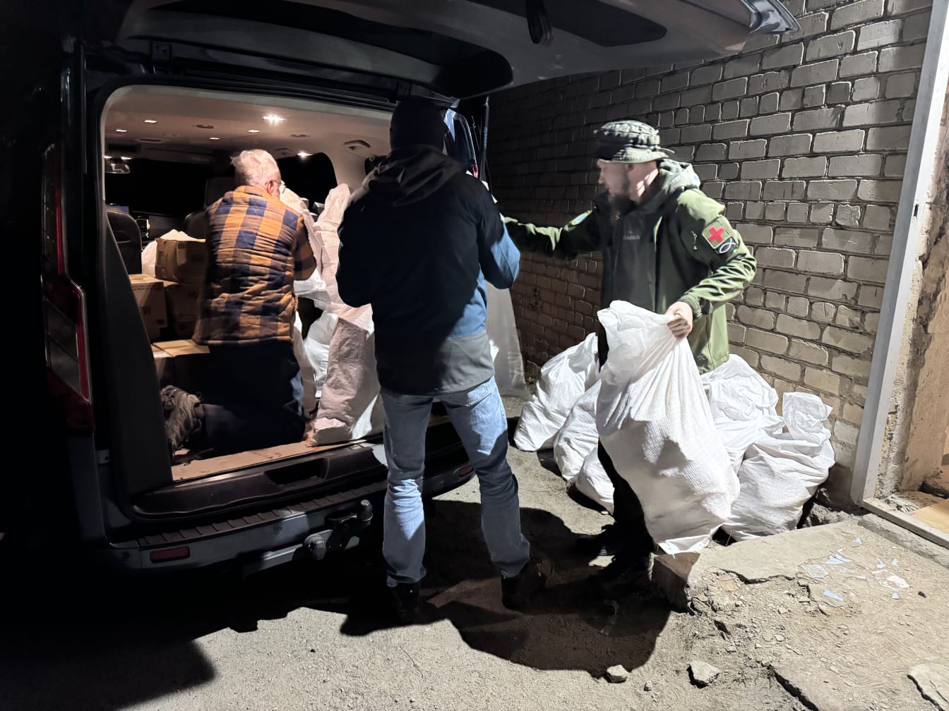 Loading bread into the van in preparation for the next day&rsquo;s outreach.