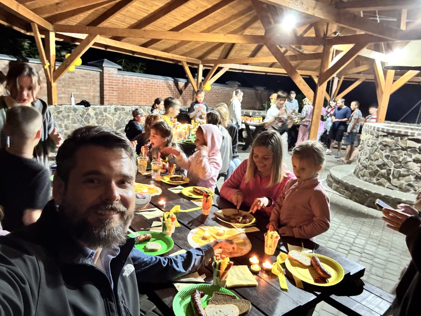 Exchanging stories (some quite sad) over camp supper.
