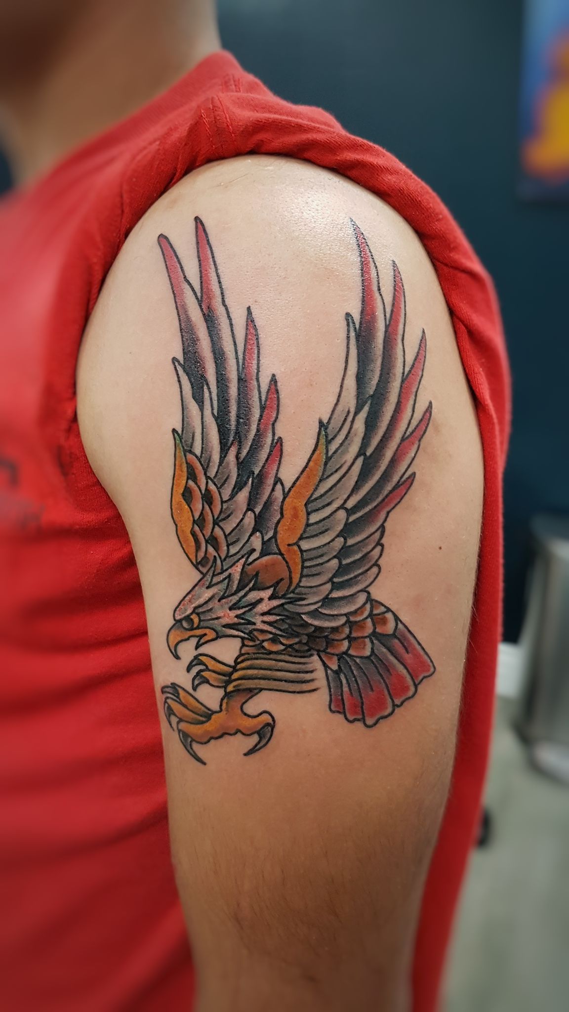 Flying eagle arm tattoo in color