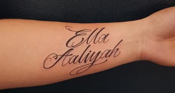 Script arm tattoo