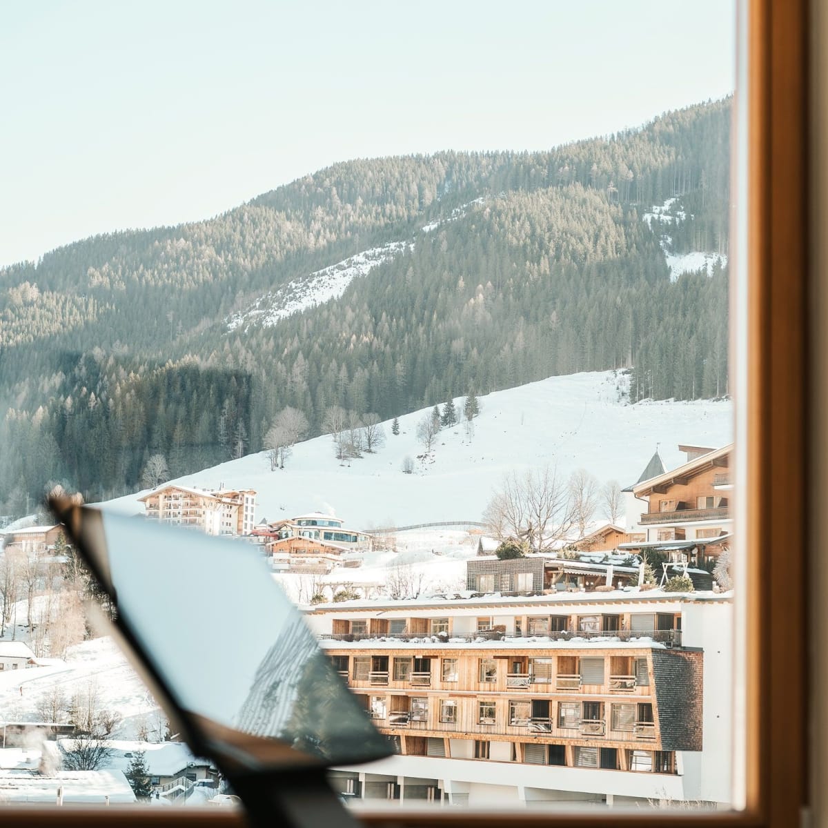Mountain view over the snowy Glemmtal with Glemmtalerhof in Hinterglemm in the