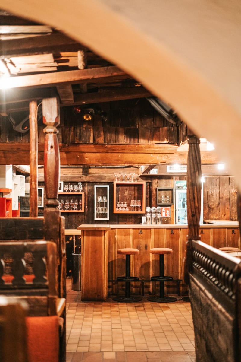 Cozy bar in Glemmtalerhof in Hinterglemm with wooden details and seating.