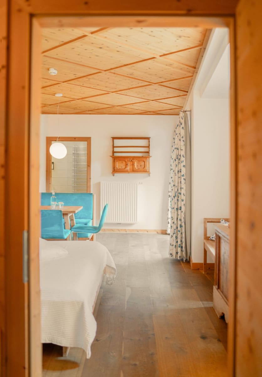 View of a room at Glemmtalerhof in Hinterglemm with cozy decor and light wood.