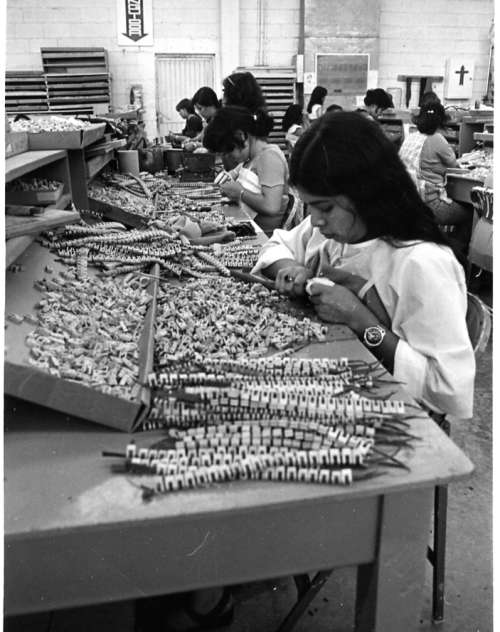 Two men working on a Kimball organ.