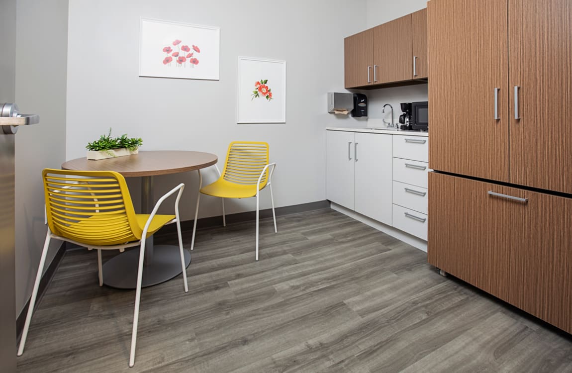 Empty Room having yellow chairs and table