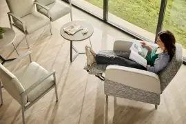 Comfort-focused recliner chair with wheels in a calm, contemporary room.