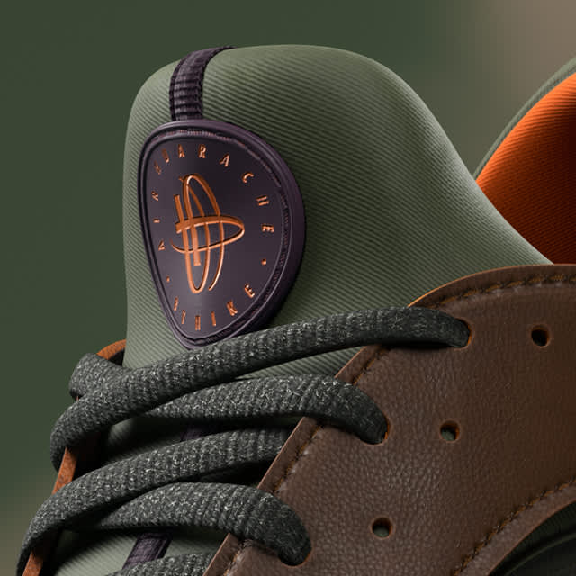 Huarache Nike sneaker tongue and laces with green and brown leather. Logo in orange